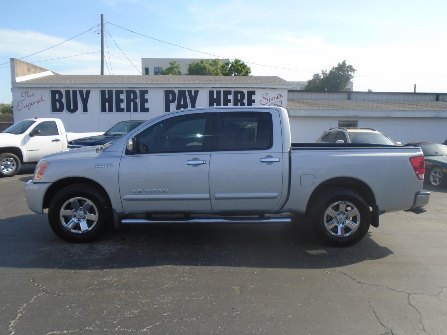 2012 Silver /Grey Nissan Titan SV Crew Cab 2WD (1N6BA0ED4CN) with an 5.6L V8 DOHC 32V FFV engine, 5-Speed Automatic transmission, located at 6112 N Florida Avenue, Tampa, FL, 33604, (888) 521-5131, 27.954929, -82.459534 - Photo#0